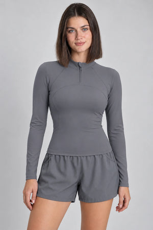 WEARHUB Polyester-Spandex Half-Zip Long-Sleeve Active Top — Black, front view
