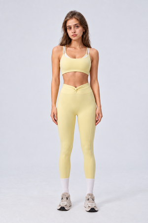 WEARHUB Nylon-Spandex Color-Block Layered-Look Sports Bra — Light Yellow, front view