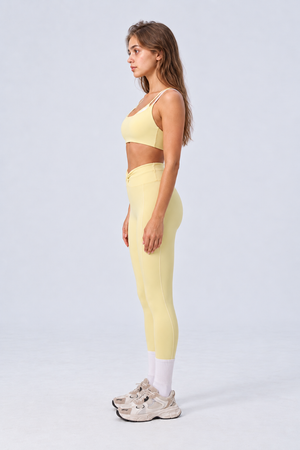WEARHUB Nylon-Spandex Color-Block Layered-Look Sports Bra — Light Yellow, side view